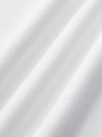 White ribbed Ellis Sleeveless Crop Top with soft diagonal ridges and gentle wavy folds.
