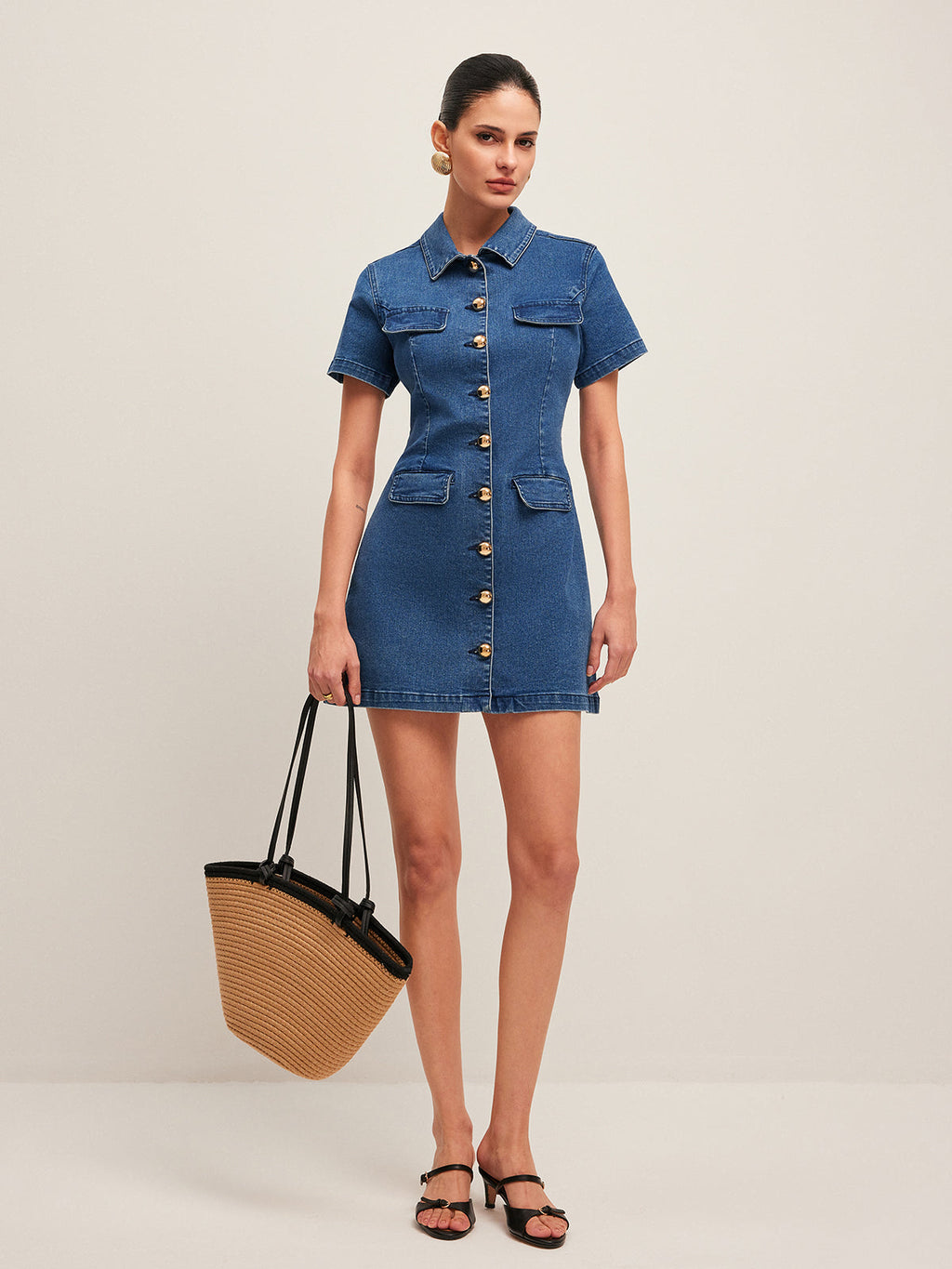 The LA FINE FLEUR Stylish Denim Dress features a button-down front and sleek silhouette.