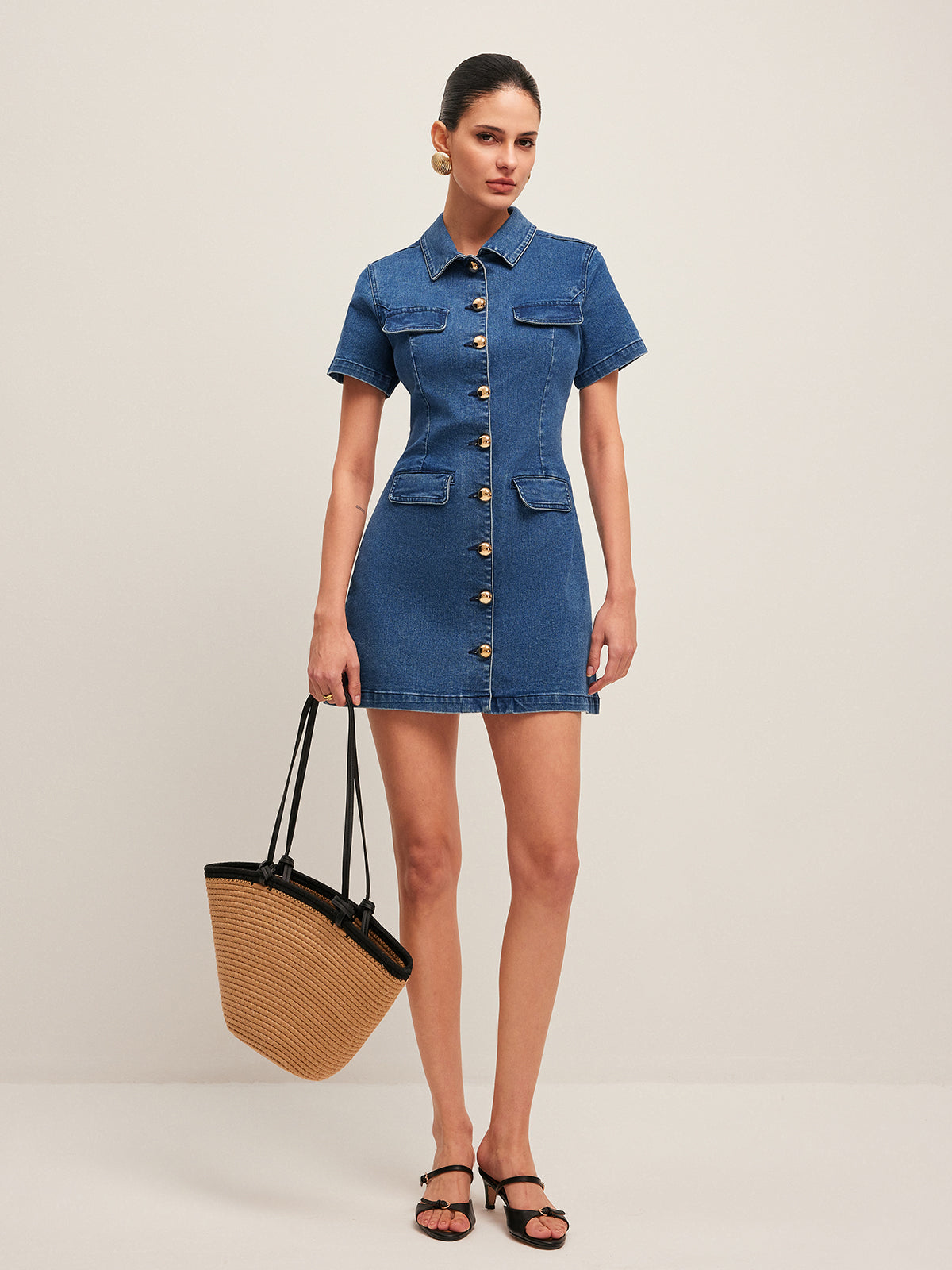 The LA FINE FLEUR Stylish Denim Dress features a button-down front and sleek silhouette.