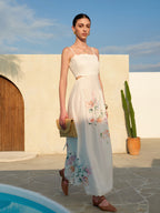 LA FINE FLEUR Floral Lace-Up Sleeveless Dress with Back Detail and sandals.