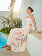 Floral lace-up sleeveless dress with back detail, featuring cutouts and adjustable straps.