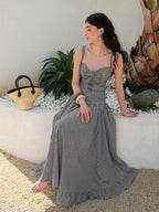 A gingham sleeveless dress with a belted waist from LA FINE FLEUR.