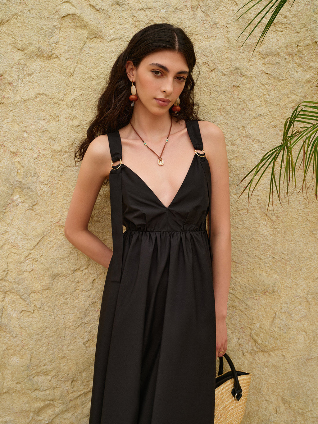 LA FINE FLEUR Strappy A-Line Dress featuring a striking backless design in light fabric.