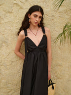 LA FINE FLEUR Strappy A-Line Dress featuring a striking backless design in light fabric.