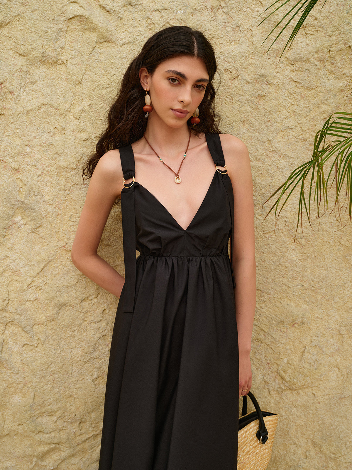 LA FINE FLEUR Strappy A-Line Dress featuring a striking backless design in light fabric.