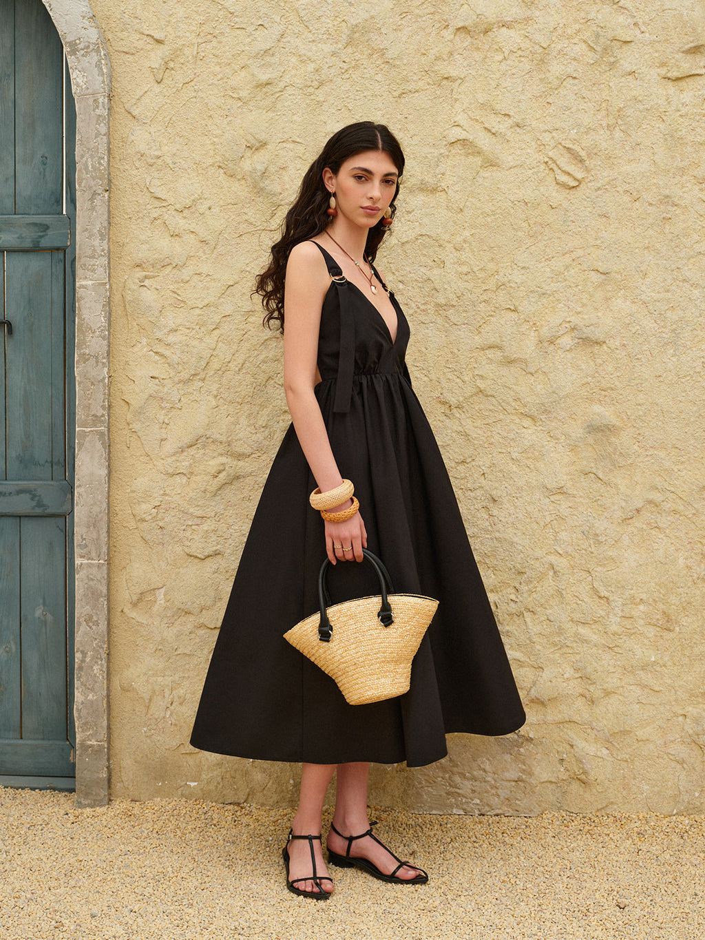 A strappy A-line dress with a backless design from LA FINE FLEUR.
