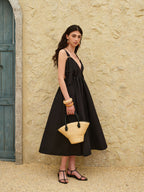 A strappy A-line dress with a backless design from LA FINE FLEUR.