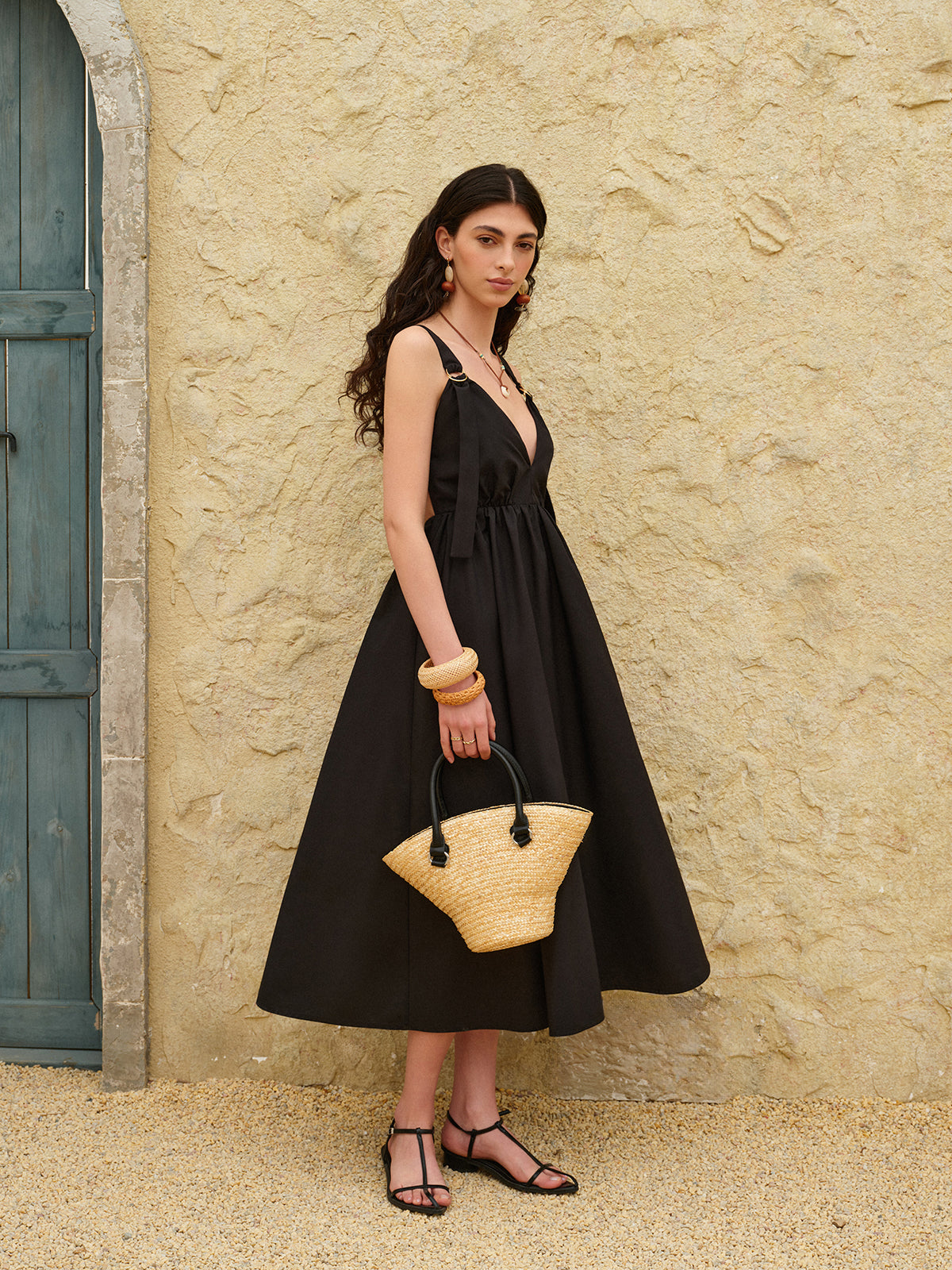 A strappy A-line dress with a backless design from LA FINE FLEUR.