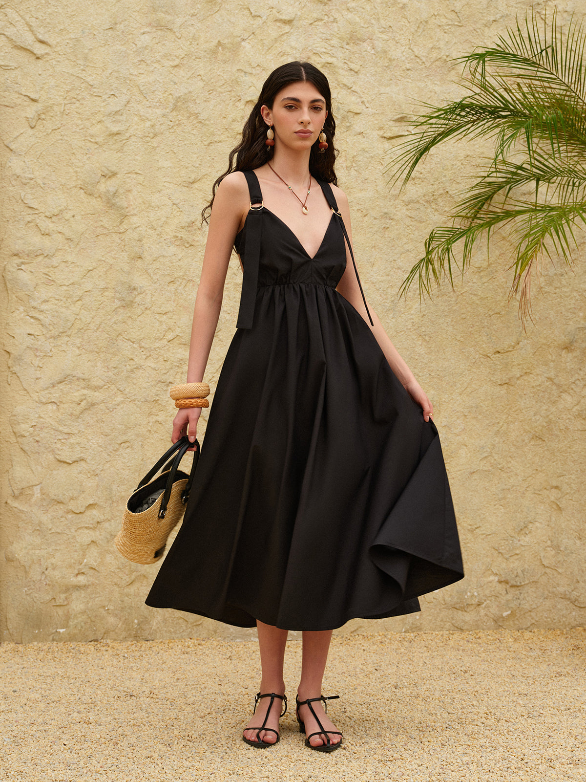 A strappy A-line dress with a backless design in a light, airy fabric.