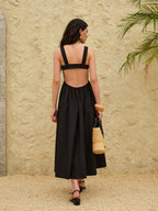 LA FINE FLEUR strappy A-line dress with a backless design in lightweight fabric.