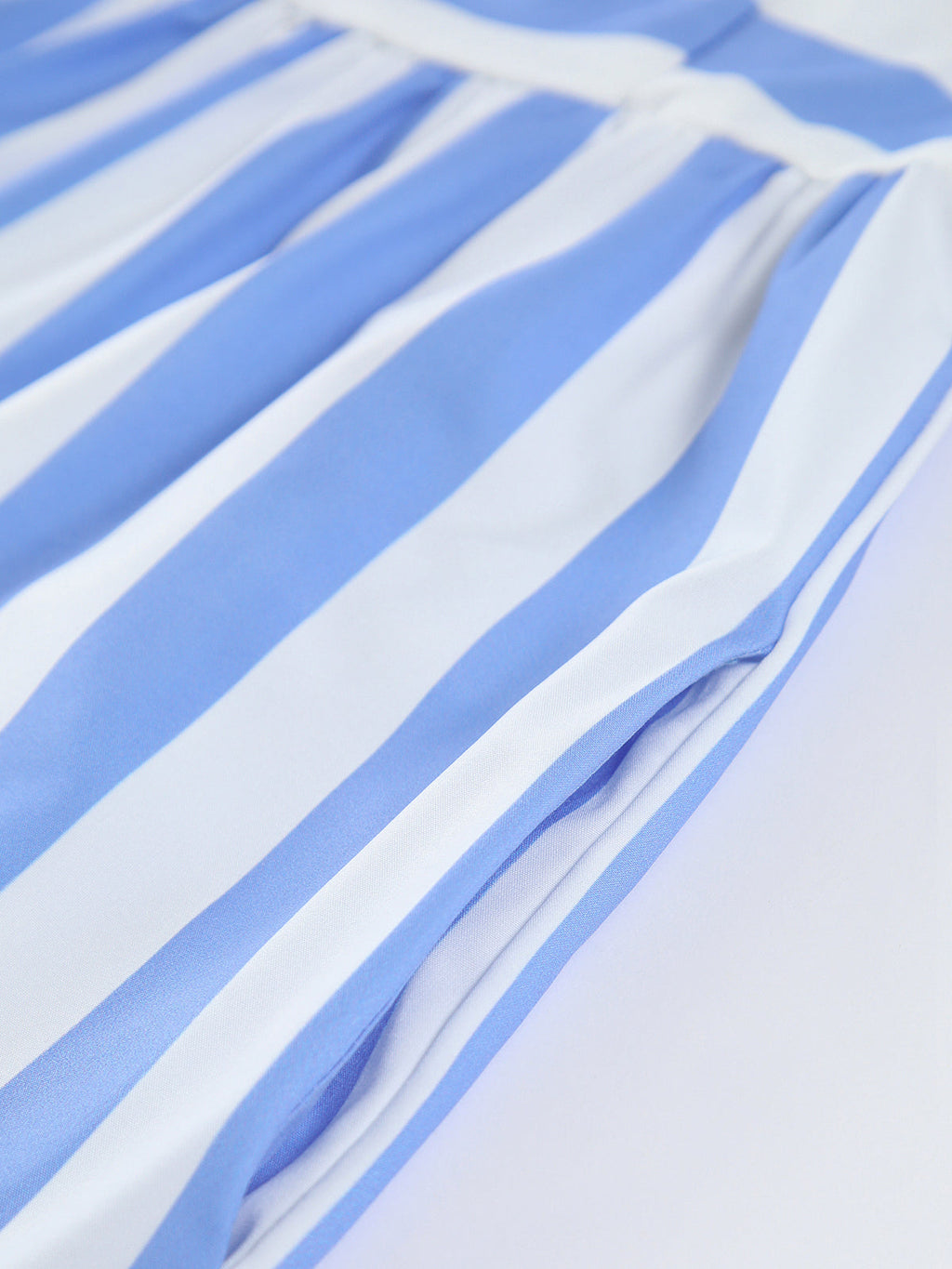 Light blue and white striped backless long dress with pockets, smooth soft fabric texture.
