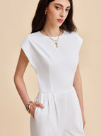 A cap sleeve jumpsuit with buttoned backless design from LA FINE FLEUR.