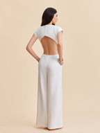LA FINE FLEUR Cap Sleeve Jumpsuit with buttoned backless design and wide-leg pants.