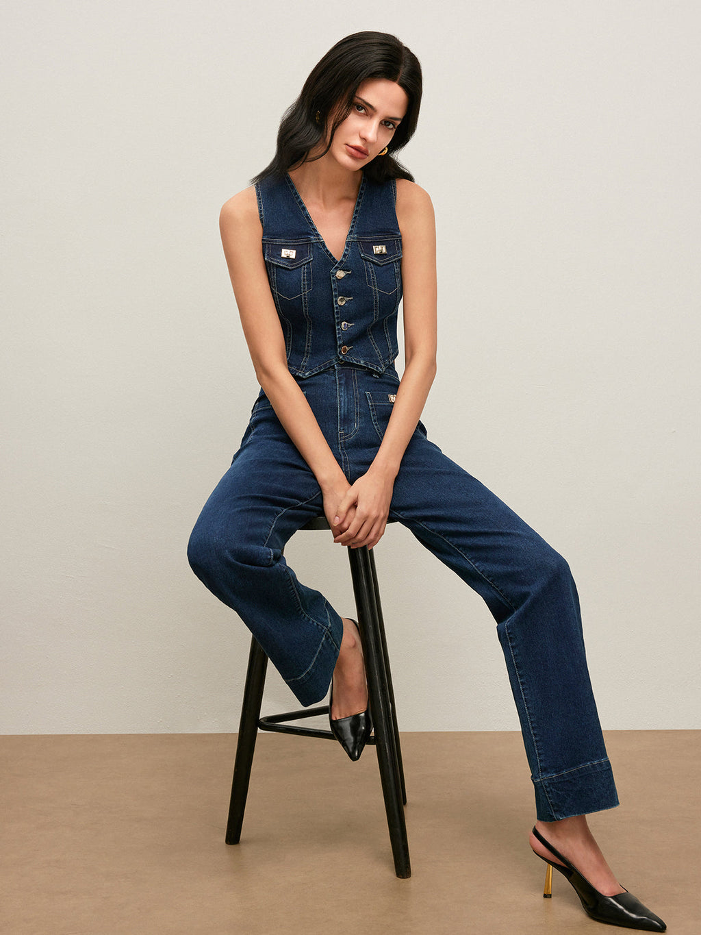 LA FINE FLEUR Vintage Denim Vest with Button-Down Front and black high heels.
