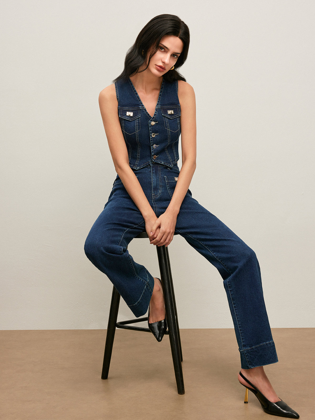 LA FINE FLEUR Vintage Denim Vest with Button-Down Front and black high heels.
