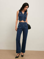 A vintage denim vest with button-down front, paired with matching high-waisted denim pants.