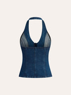A sleeveless denim halter top with deep V-neck, button accents, and visible fitted seams.