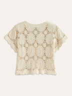 Beige floral crochet cardigan with short sleeves, scalloped edges, button-up front, and airy texture.