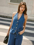 LA FINE FLEUR denim halter vest with adjustable back tie and matching denim pants.