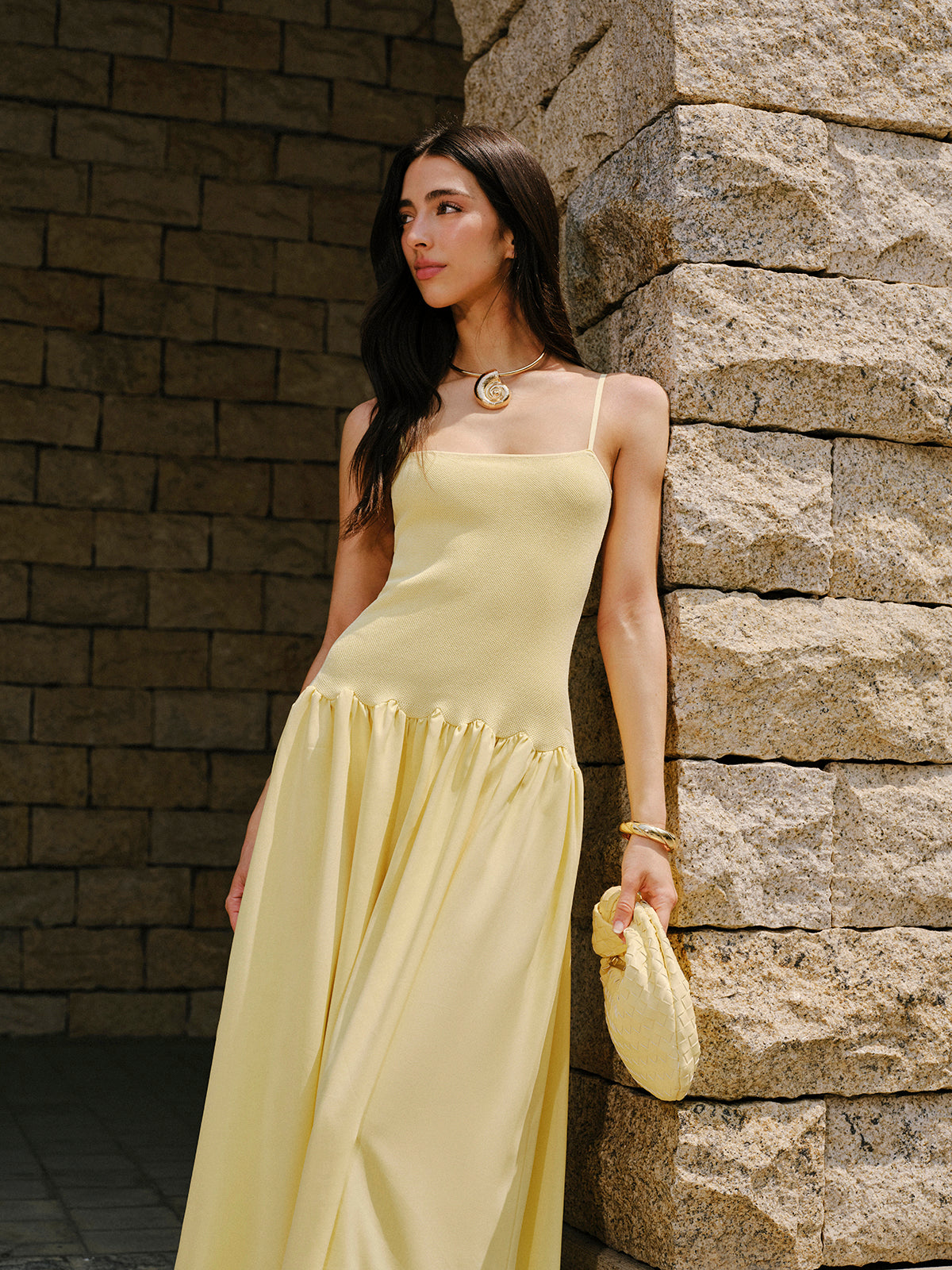 Light yellow LA FINE FLEUR cami sweater dress with pleated hem detail.