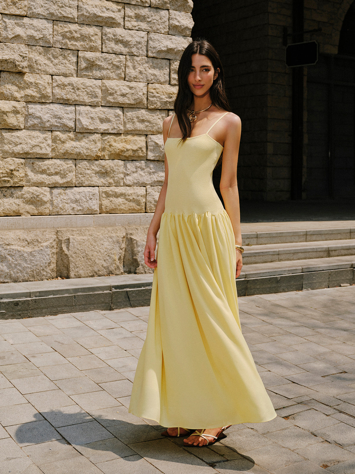 LA FINE FLEUR Cami Sweater Dress with pleated hem detail, elegant for evening wear.