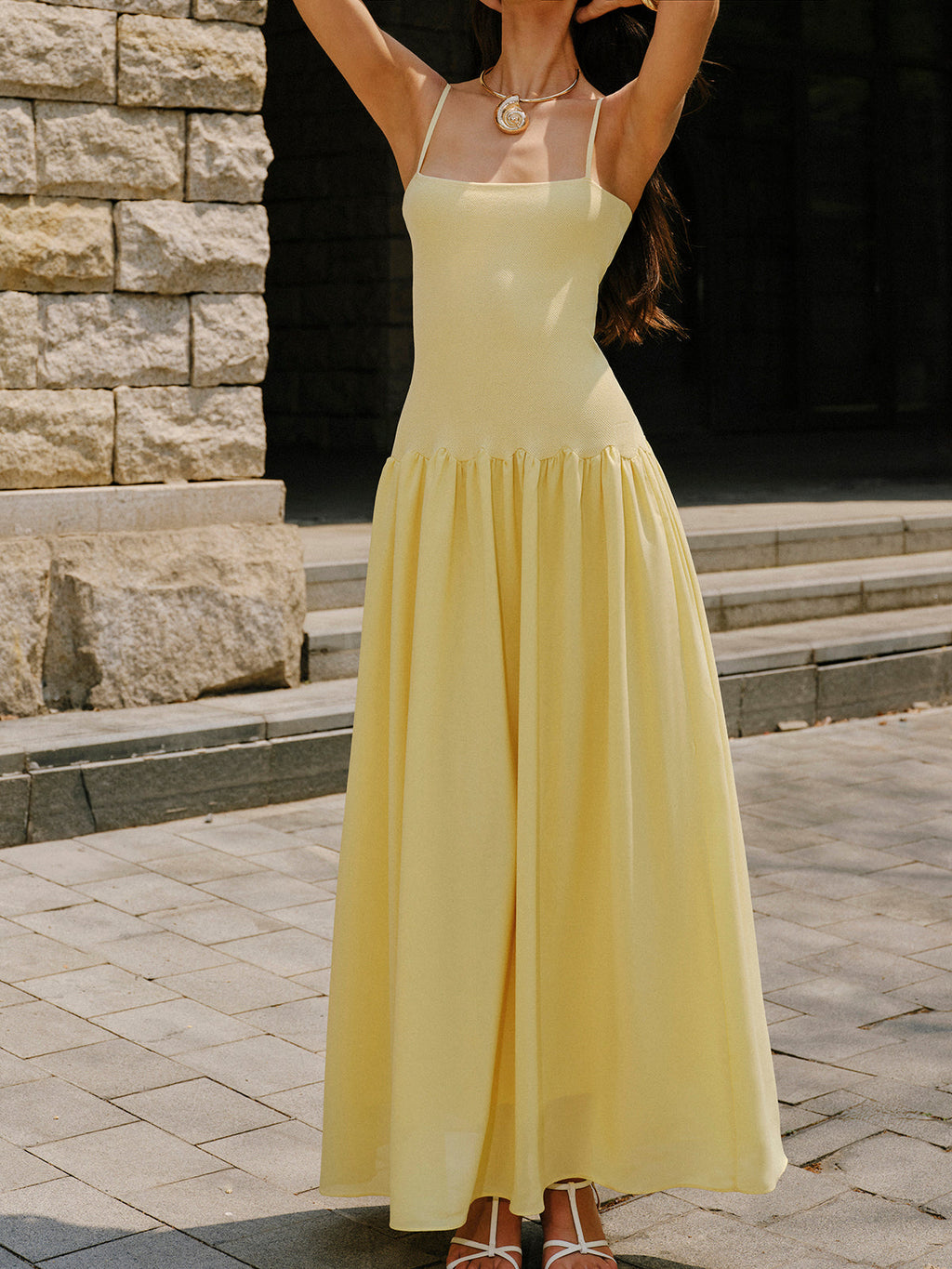 Sleeveless light yellow cami sweater dress with pleated hem detail from LA FINE FLEUR.