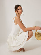 Square neckline dress with pleated detail, crafted in a light fabric and elegant fit.