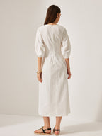 A relaxed-fit LA FINE FLEUR cotton and linen midi dress with puff sleeves.