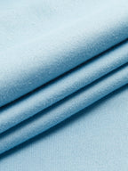 Light blue, soft knit fabric tailored into an asymmetrical neckline sleeveless BYPINKYPARIS top.