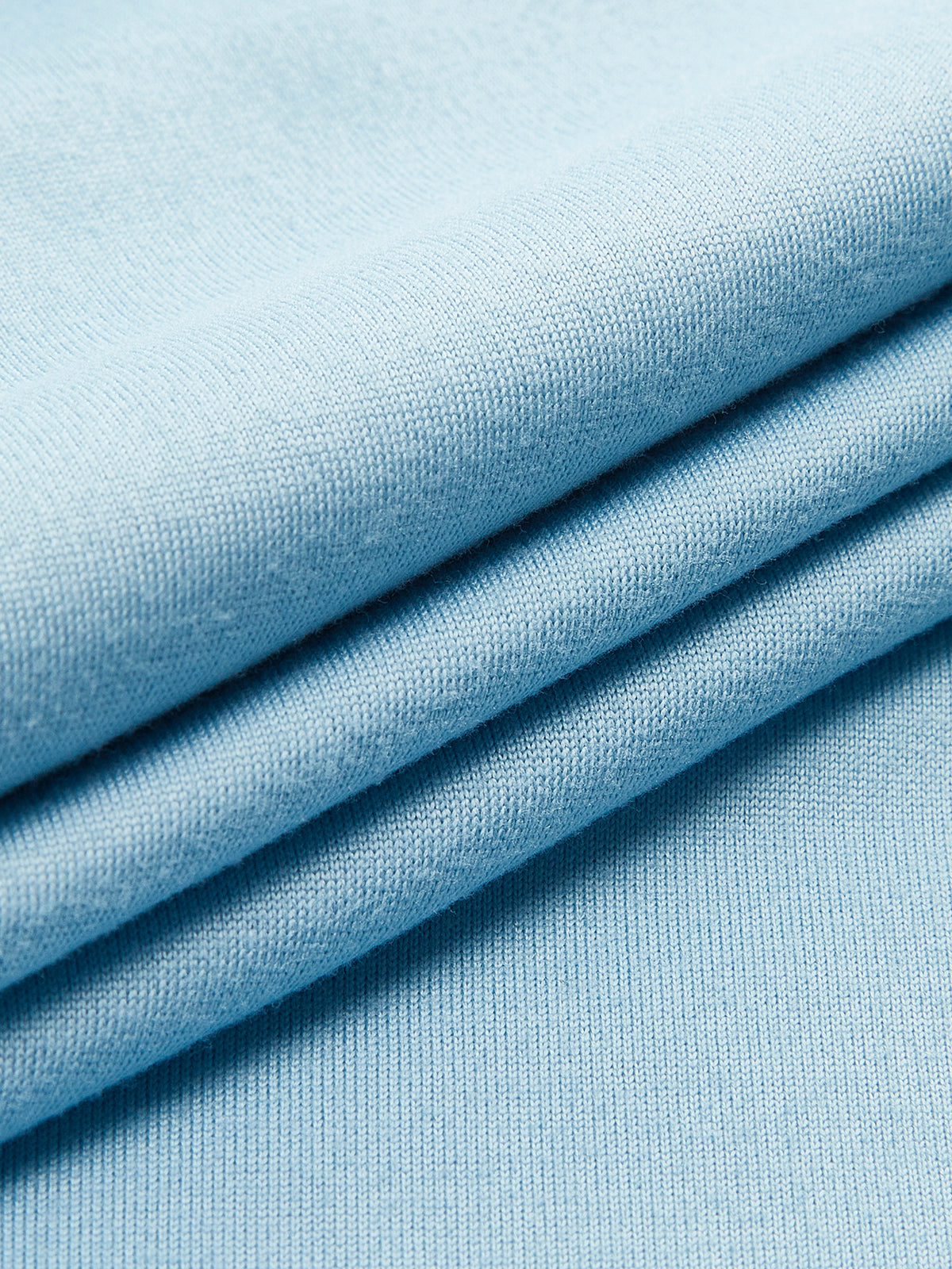 Light blue, soft knit fabric tailored into an asymmetrical neckline sleeveless BYPINKYPARIS top.