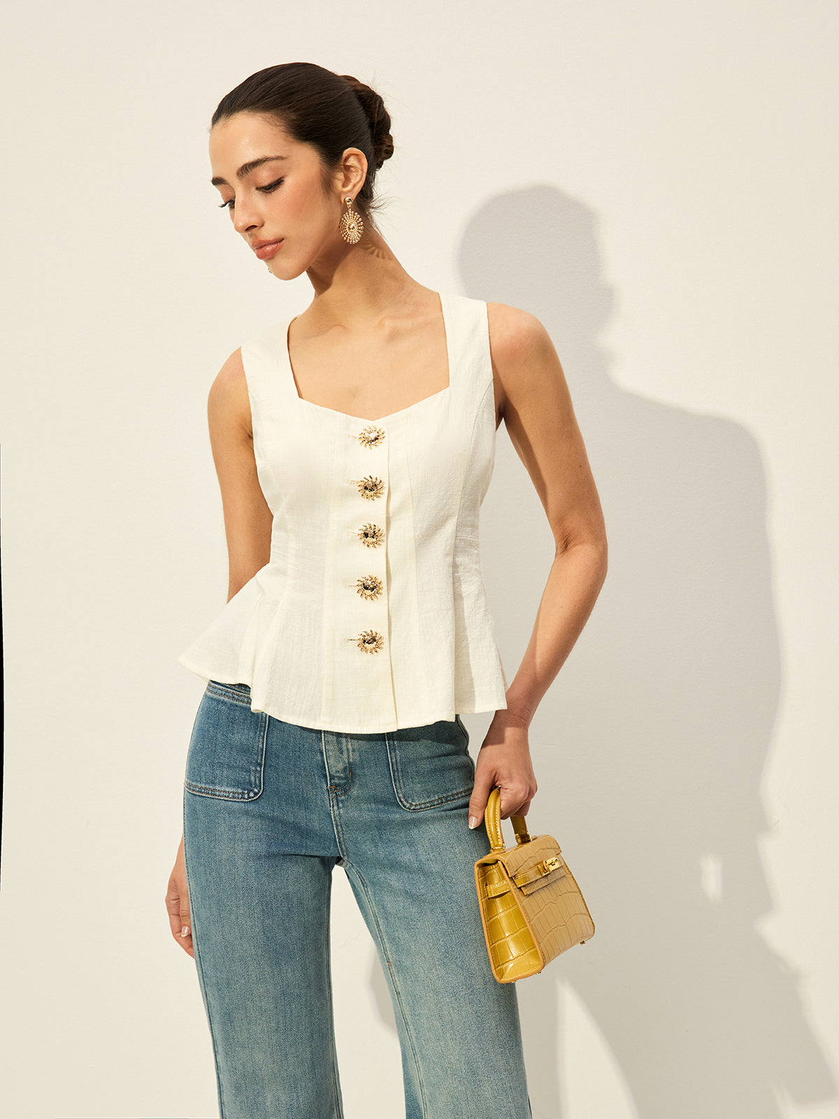 Square neckline buttoned peplum blouse with gold sunflower buttons paired with blue jeans.