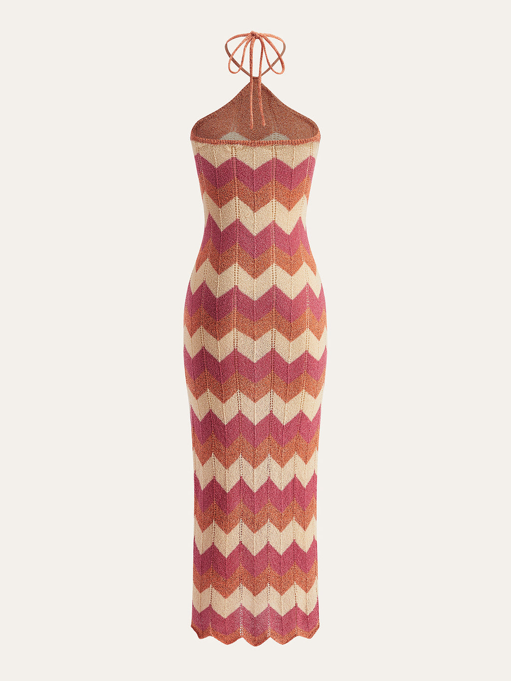 Sleeveless slim-fit chevron maxi dress in brown, pink, orange, and cream with a knotted split sweater.