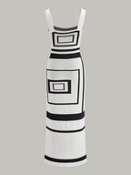 A sweater dress with a geometric panel pattern, square neckline, sleeveless fit, and wide straps.