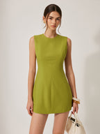LA FINE FLEUR cotton and linen backless dress featuring a metal accent detailing.