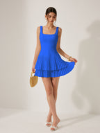 Bright blue LA FINE FLEUR Square Neckline Dress with pleated detail and elegant silhouette.