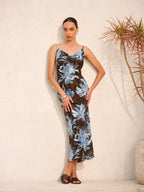 Sleeveless floral dress with tie-back detail in a lightweight fabric and delicate print.