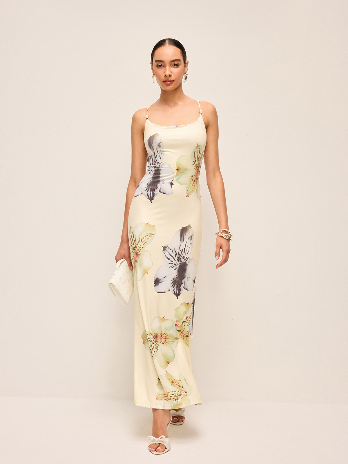 LA FINE FLEUR floral dress with lace-up backless design, featuring vibrant florals and delicate details.