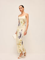 A light yellow floral LA FINE FLEUR dress with adjustable straps and lace-up backless design.