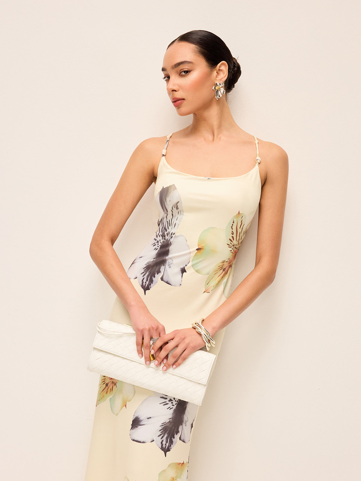 A LA FINE FLEUR floral dress featuring a lace-up backless design.