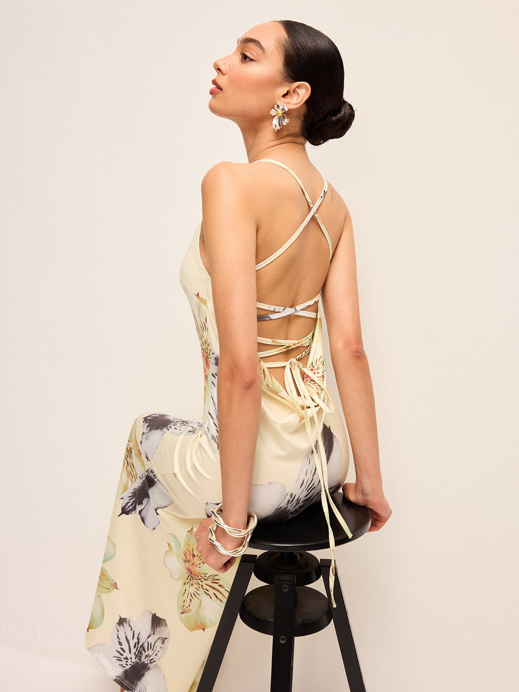 The LA FINE FLEUR Floral Dress with cream print and lace-up crisscross back straps.