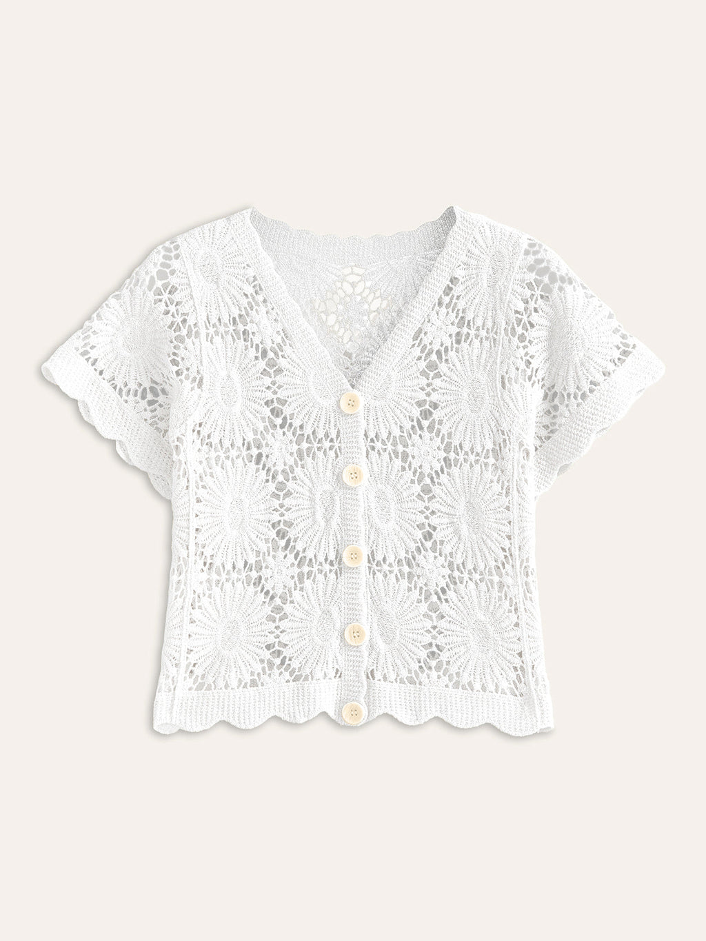 White, short-sleeve crochet cardigan with V-neck, scalloped edges, cream buttons, and lacy texture.