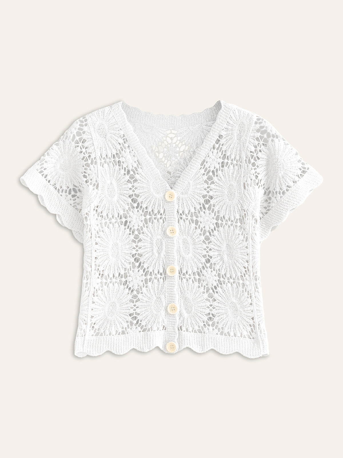 White, short-sleeve crochet cardigan with V-neck, scalloped edges, cream buttons, and lacy texture.