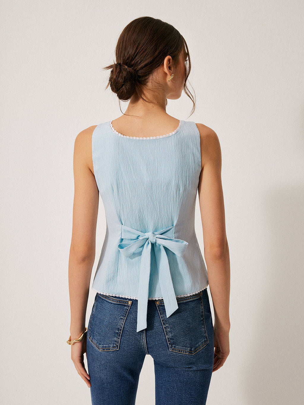 LA FINE FLEUR Lace-Trimmed Button-Front Blouse paired with classic blue jeans.