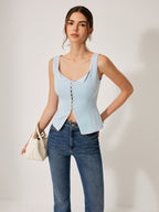 A lace-trimmed, button-front blouse styled with classic blue jeans.