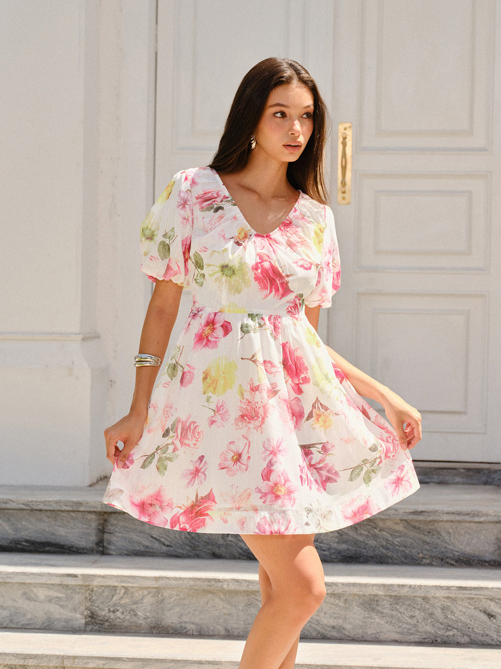 LA FINE FLEUR Puff Sleeve Dress featuring an elegant floral design and flowing silhouette.