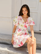 LA FINE FLEUR puff sleeve dress featuring an elegant floral design and soft, flowing fabric.