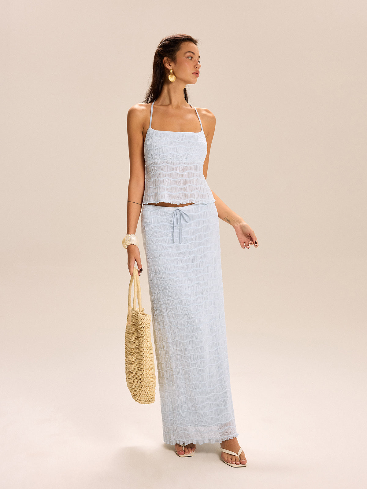LA FINE FLEUR Textured Halter Top paired with a matching coordinating skirt set.