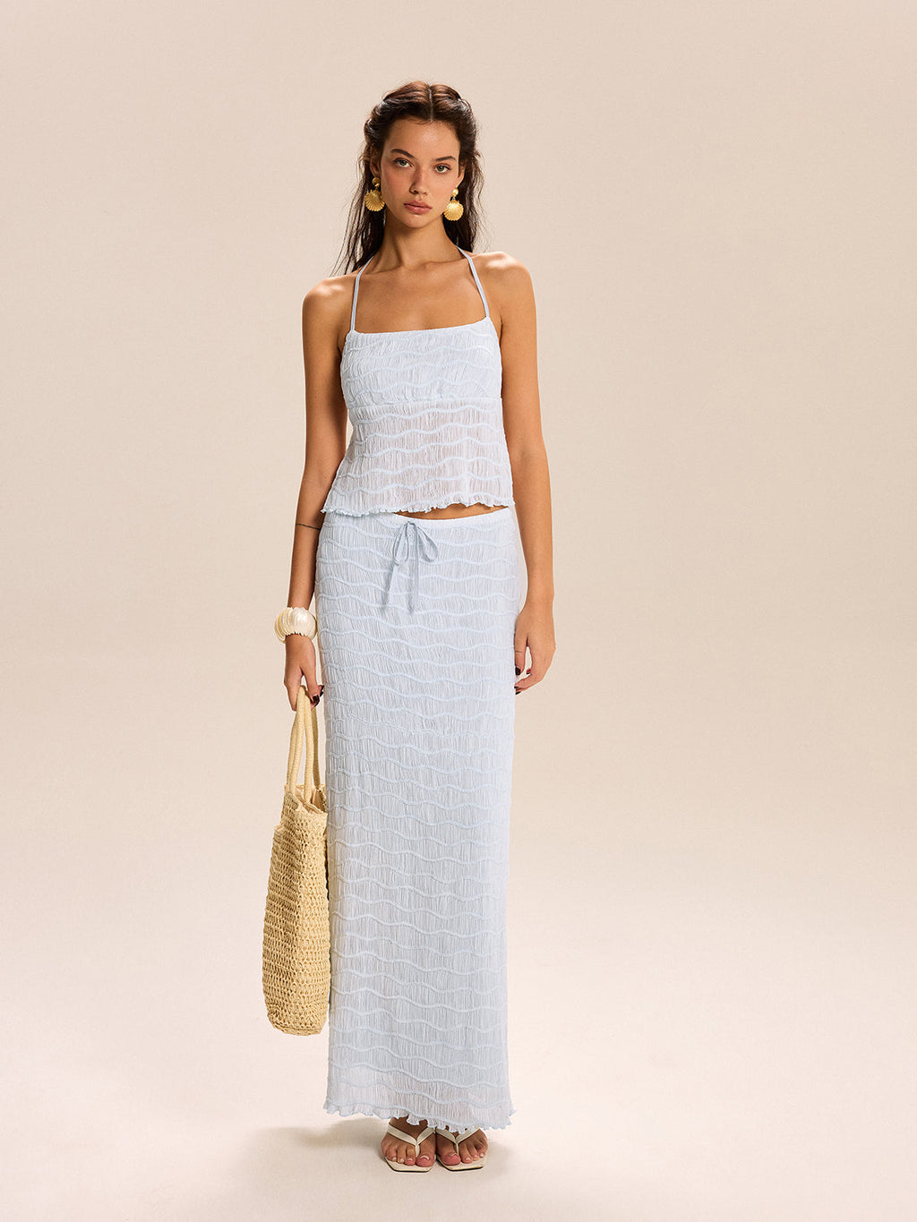 The LA FINE FLEUR textured halter top paired with a coordinating matching skirt set.