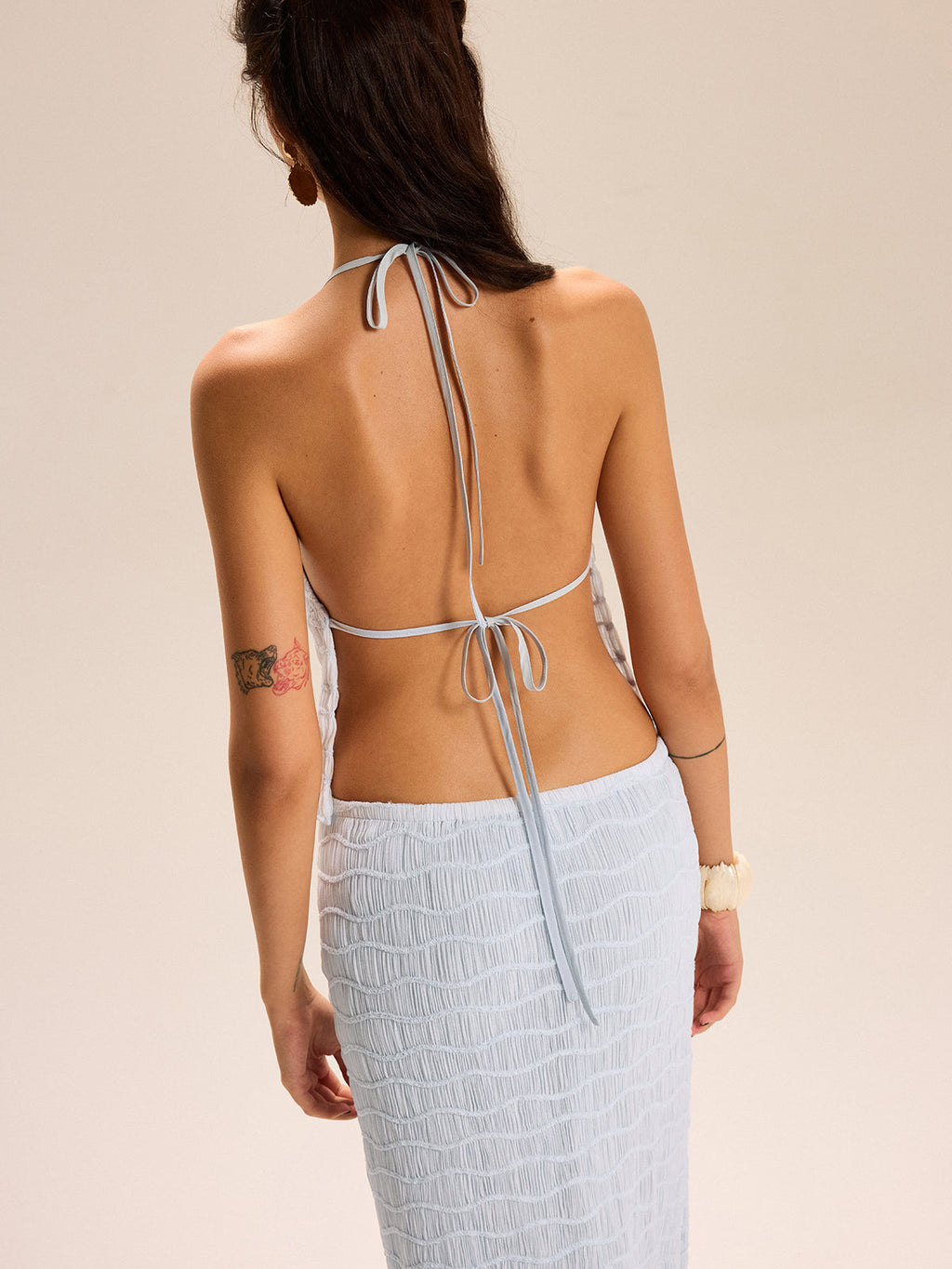 The LA FINE FLEUR Textured Halter Top paired with a matching coordinating skirt set.