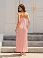 LA FINE FLEUR Spaghetti Strap Pleated Maxi Dress in light pink with flat sandals.